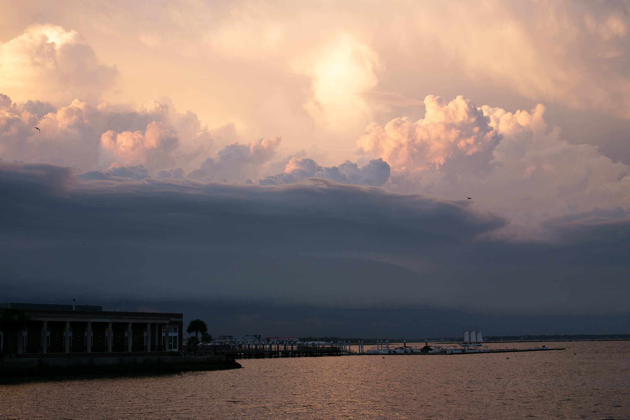 Stormy clouds at sunset over Charleston harbor SC