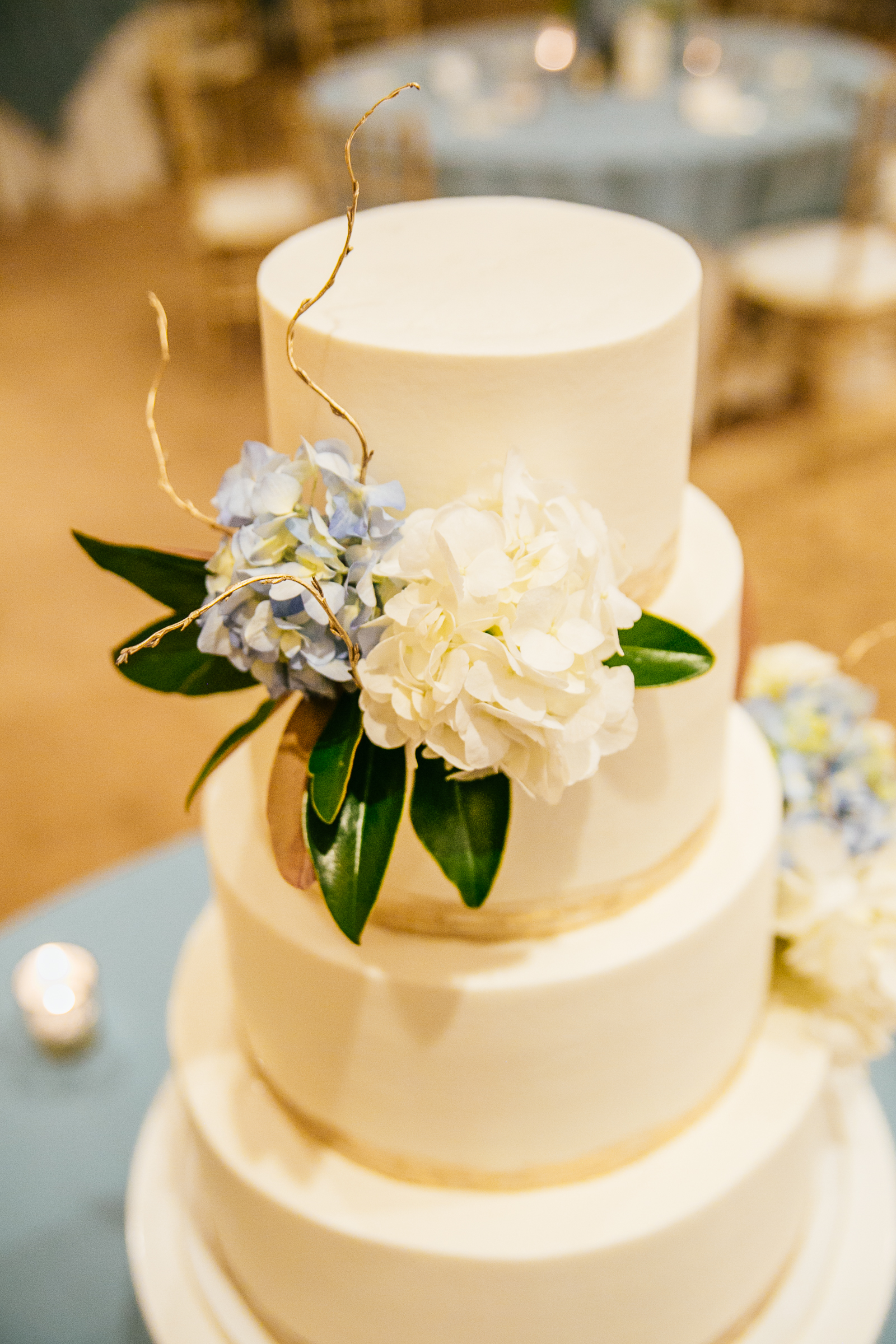 smooth buttercream cake with hydrangea and gold accents at pawleys island plantation